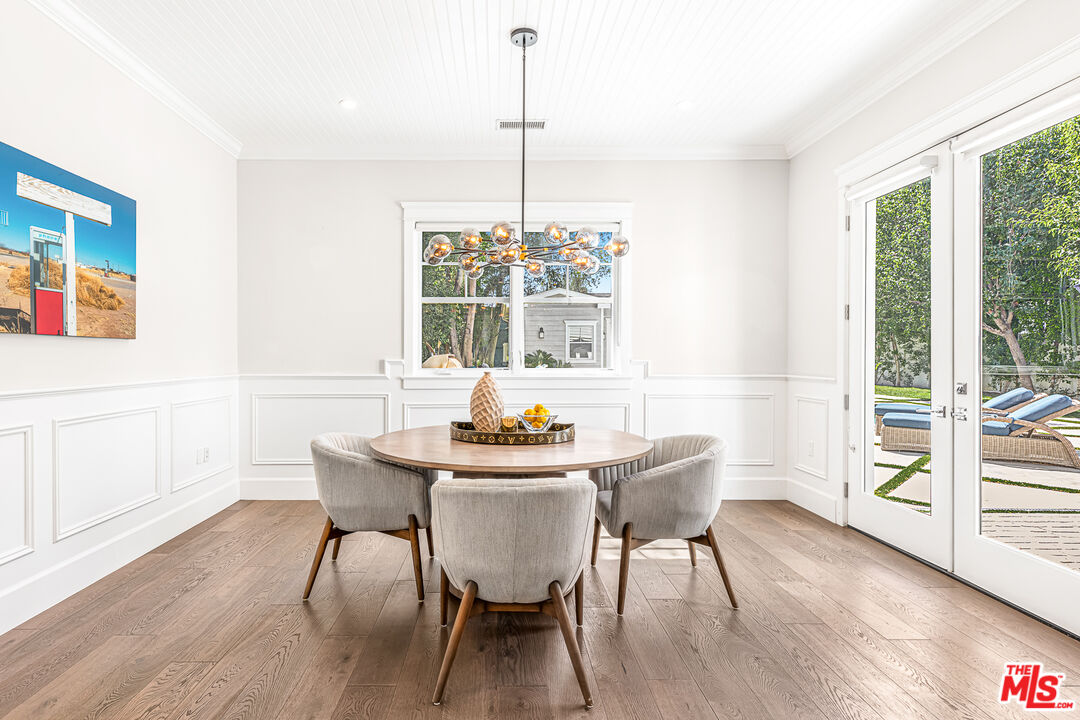 17524 Jayden Lane Encino, CA 91316 - Photo 23 of 52 a dining room with furniture window wooden floor