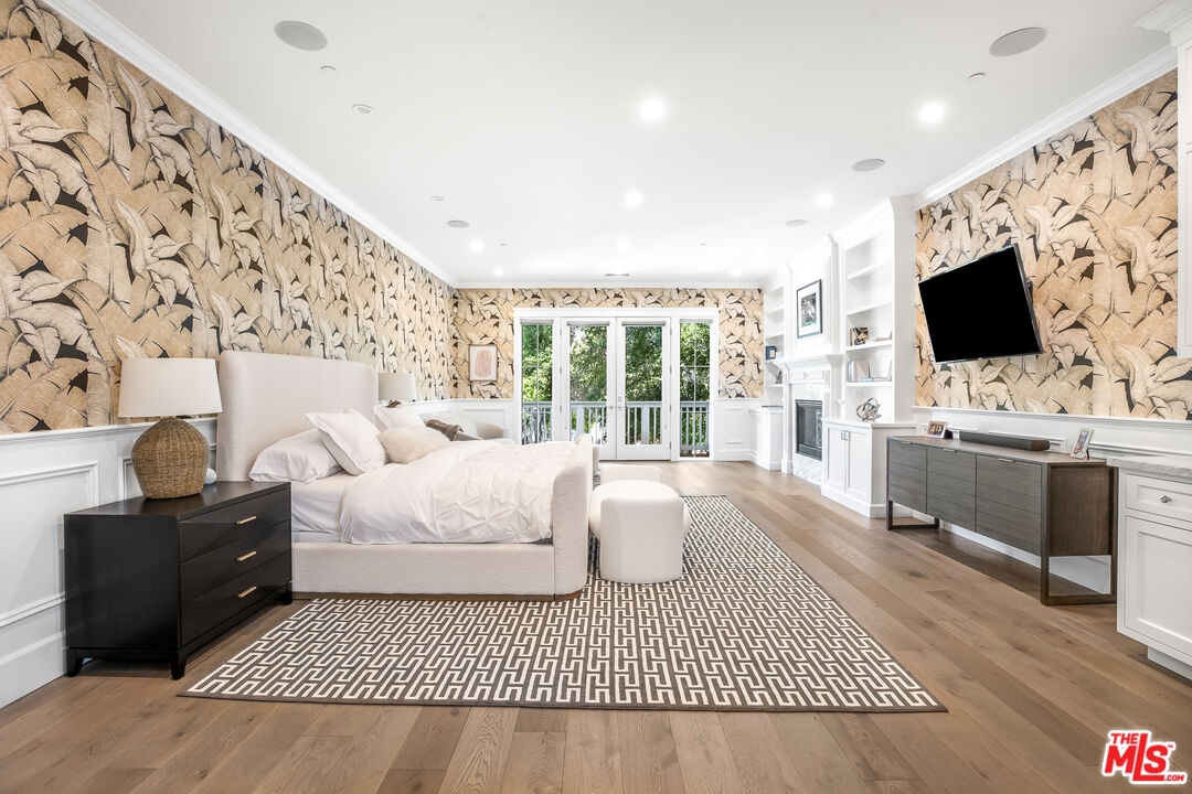 17524 Jayden Lane Encino, CA 91316 - Photo 29 of 52 a living room with furniture a flat screen tv and a fireplace