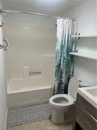 a bathroom with a sink toilet and mirror