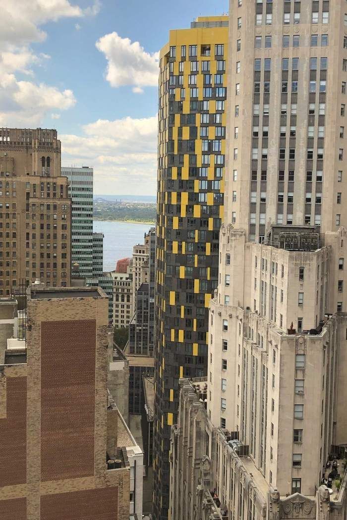 a view of a city with tall buildings