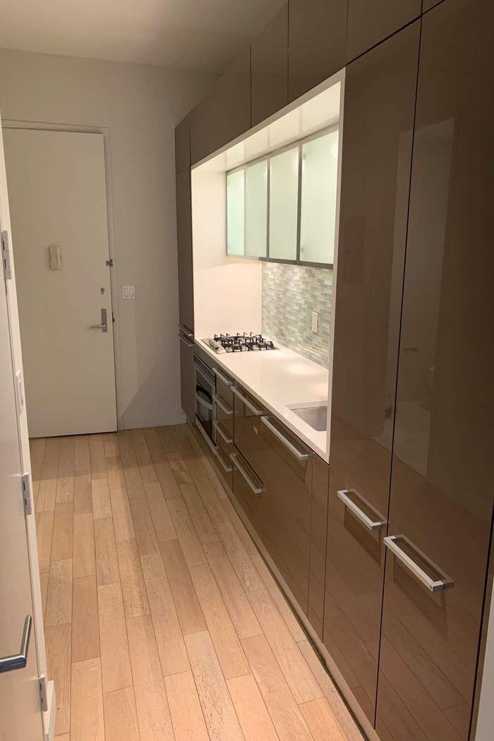 75 Wall Street, Unit 38J Manhattan, NY 10005 - Photo 5 of 8 a view of an empty room with a window