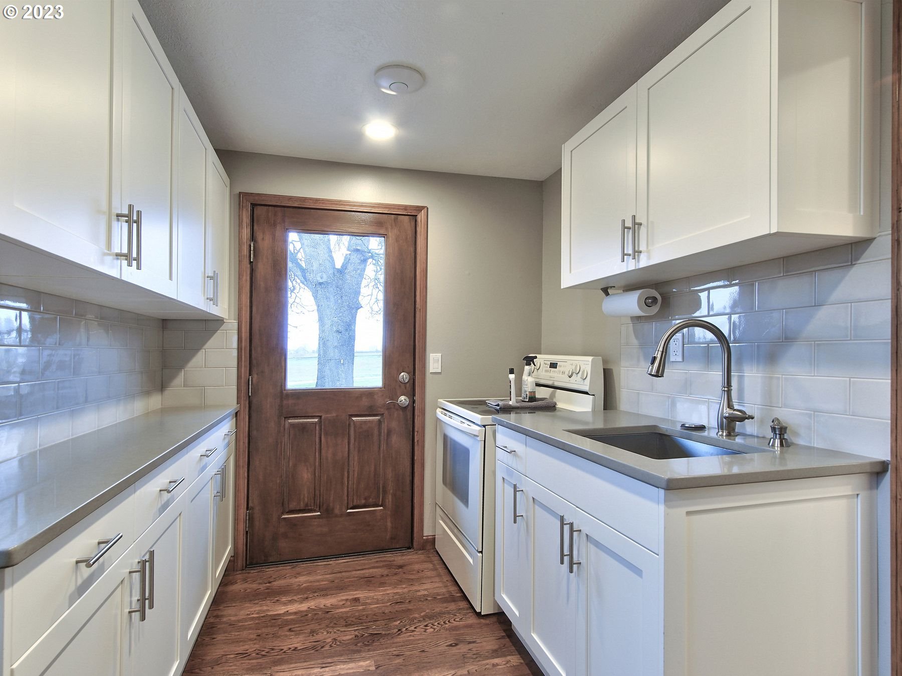 32840 South Meridian Road Woodburn, OR 97071 - Photo 26 of 32 a kitchen with granite countertop a sink stainless steel appliances and cabinets