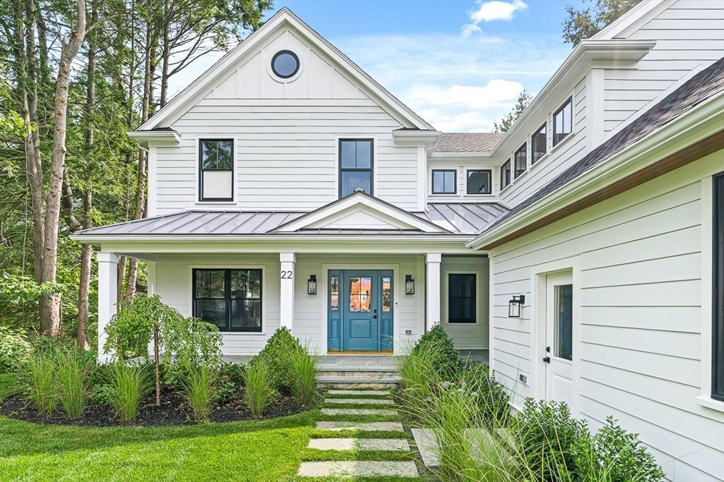 22 Priscilla Circle Wellesley, MA 02481 - Photo 2 of 38 a front view of a house with garden