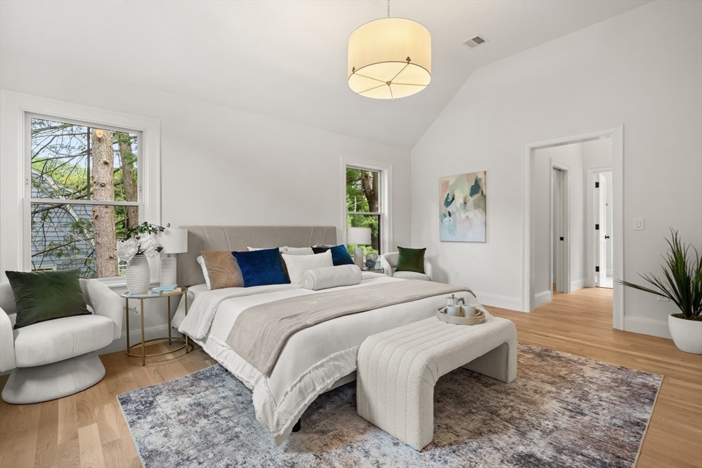 22 Priscilla Circle Wellesley, MA 02481 - Photo 25 of 38 a bedroom with a bed and a chandelier