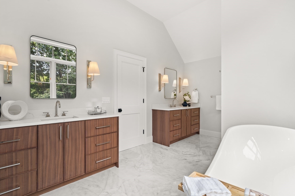 22 Priscilla Circle Wellesley, MA 02481 - Photo 26 of 38 a spacious bathroom with a double vanity sink a mirror and a bathtub