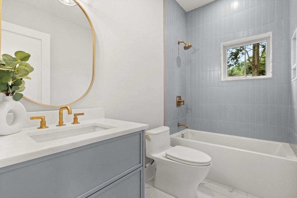 22 Priscilla Circle Wellesley, MA 02481 - Photo 30 of 38 a bathroom with a sink a toilet and shower