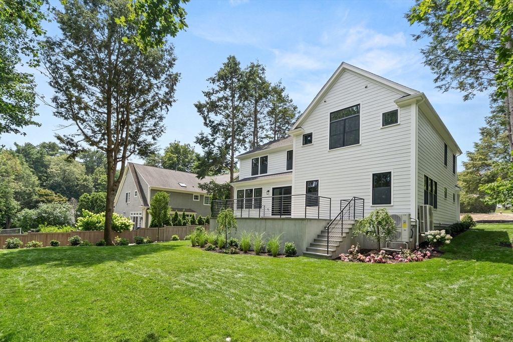 22 Priscilla Circle Wellesley, MA 02481 - Photo 35 of 38 a front view of house with a garden and deck