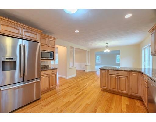 24 Regency Drive Dracut, MA 01826 - Photo 14 of 42 a kitchen with stainless steel appliances granite countertop a refrigerator a sink and a stove