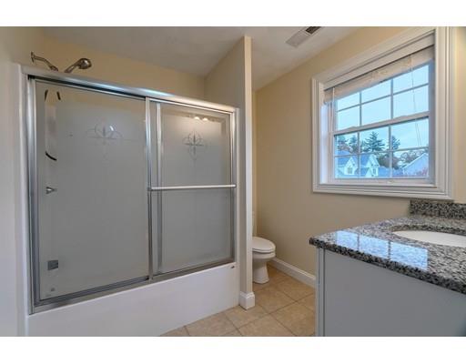 24 Regency Drive Dracut, MA 01826 - Photo 28 of 42 a bathroom with a granite countertop sink toilet and shower