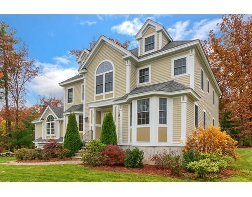 24 Regency Drive Dracut, MA 01826 - Photo 3 of 42 a front view of a house with a yard