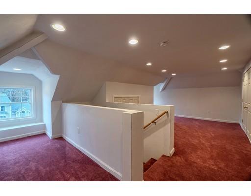 24 Regency Drive Dracut, MA 01826 - Photo 31 of 42 a view of empty room with windows and cabinet