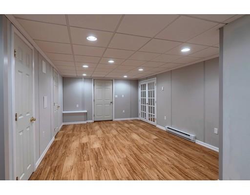 24 Regency Drive Dracut, MA 01826 - Photo 33 of 42 a view of an empty room with wooden floor