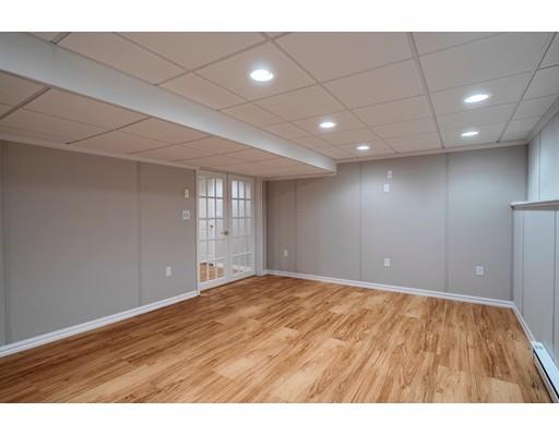 24 Regency Drive Dracut, MA 01826 - Photo 34 of 42 a view of an empty room with wooden floor