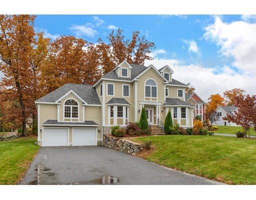 24 Regency Drive Dracut, MA 01826 - Photo 4 of 42 a front view of a house with a garden