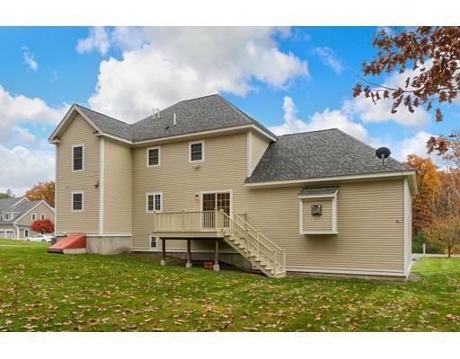 24 Regency Drive Dracut, MA 01826 - Photo 5 of 42 a front view of house with yard