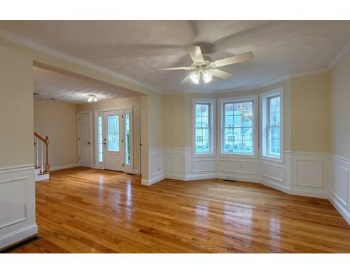 24 Regency Drive Dracut, MA 01826 - Photo 9 of 42 a view of an empty room with window and wooden floor