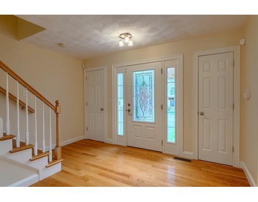 24 Regency Drive Dracut, MA 01826 - Photo 10 of 42 a view of an empty room with wooden floor and a window