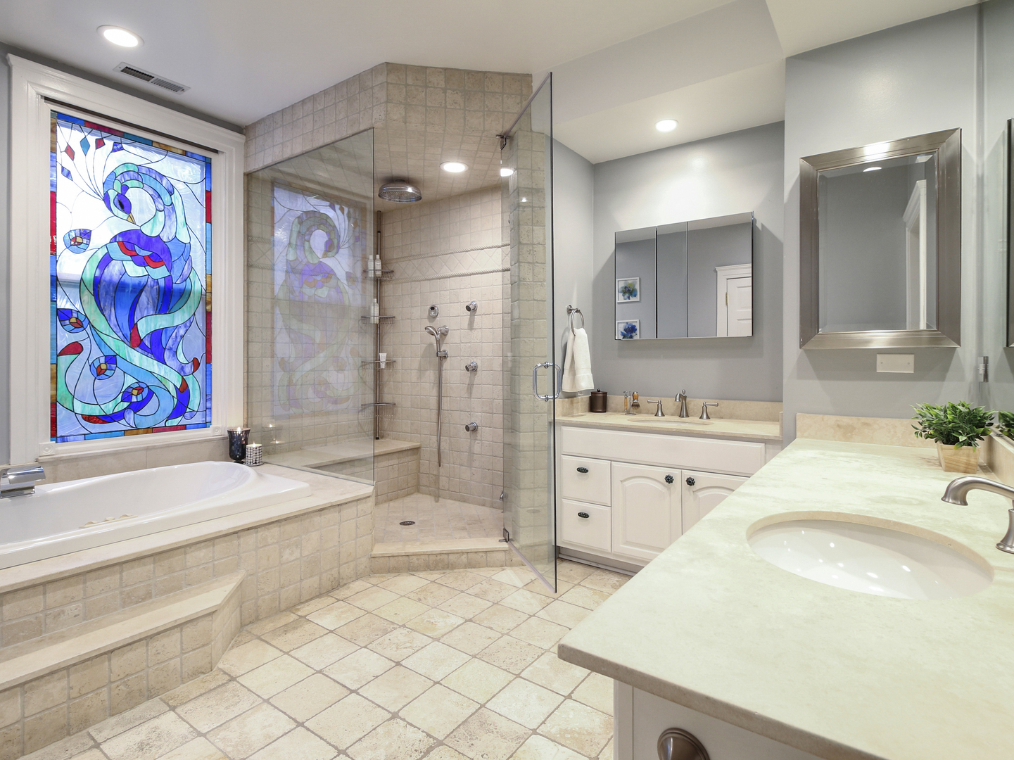 76 Logan Loop Highland Park, IL 60035 - Photo 11 of 17 a spacious bathroom with a sink a vanity and a bathtub