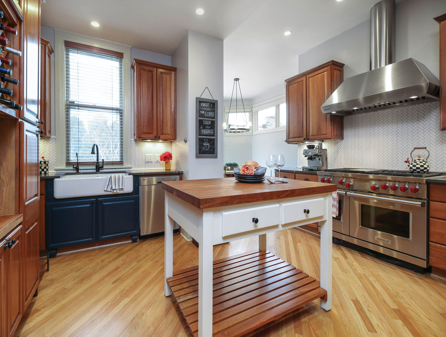 76 Logan Loop Highland Park, IL 60035 - Photo 7 of 17 a kitchen with stainless steel appliances a sink stove and wooden floor