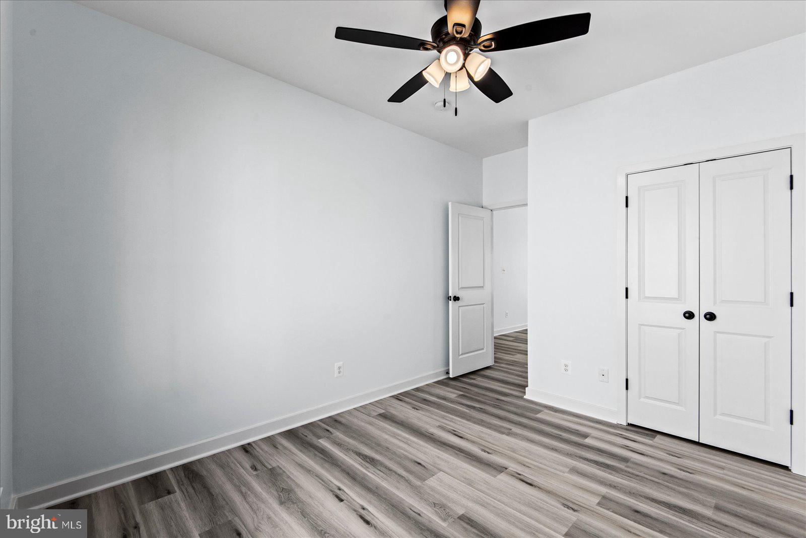 133 6th Street Colonial Beach, VA 22443 - Photo 25 of 34 wooden floor in an empty room