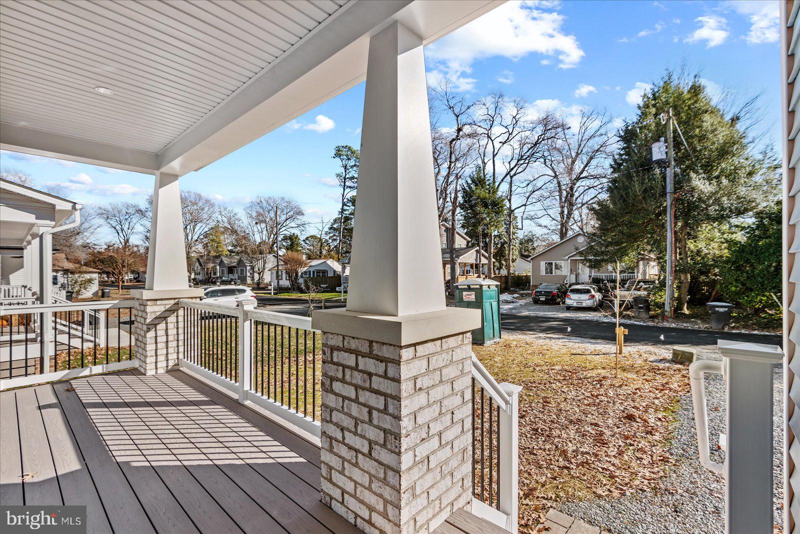 133 6th Street Colonial Beach, VA 22443 - Photo 5 of 34 a view of a balcony with wooden floor and fence