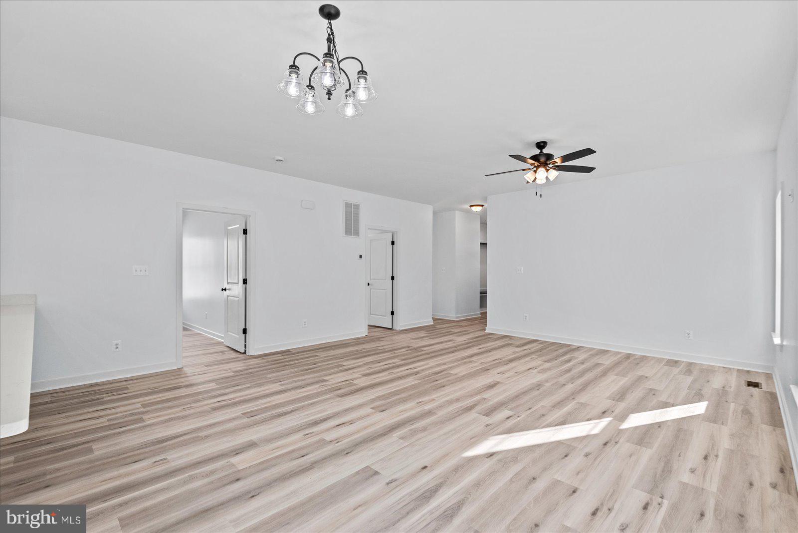 133 6th Street Colonial Beach, VA 22443 - Photo 9 of 34 a view of empty room with wooden floor