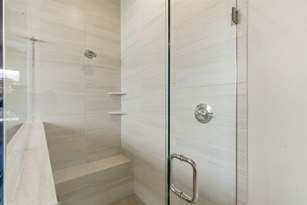 13705 Green Hook Road Fort Worth, TX 76008 - Photo 22 of 40 a bathroom with a glass shower door