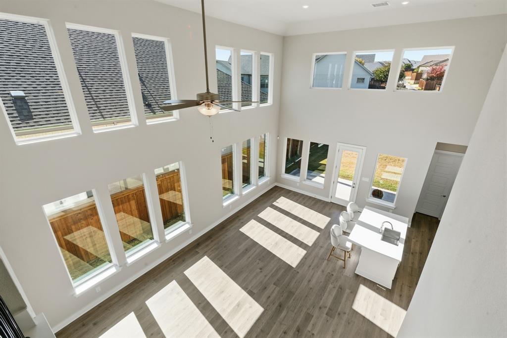 13705 Green Hook Road Fort Worth, TX 76008 - Photo 27 of 40 a living room with furniture and a fireplace