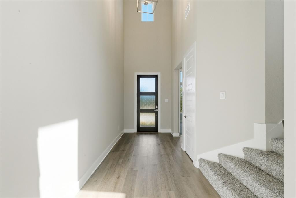 13705 Green Hook Road Fort Worth, TX 76008 - Photo 5 of 40 a view of a hallway with wooden floor and closet