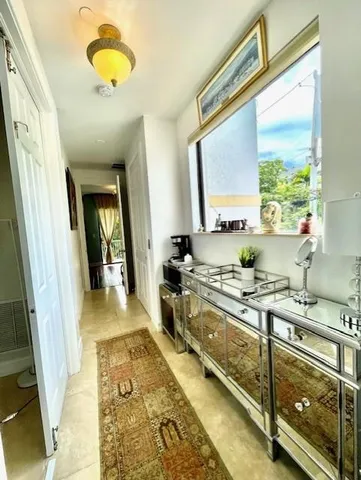 a spacious bathroom with double vanity and a bathtub