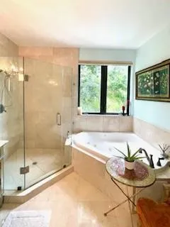 a bedroom with a bed and a painting