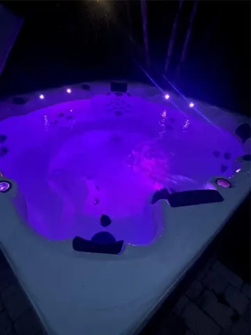 a view of a house with backyard porch and sitting area