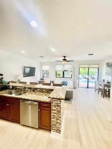 a view of a swimming pool and lounge chairs