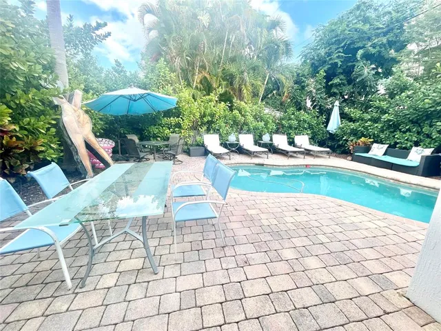a spacious bathroom with double vanity a mirror a bathtub and a shower