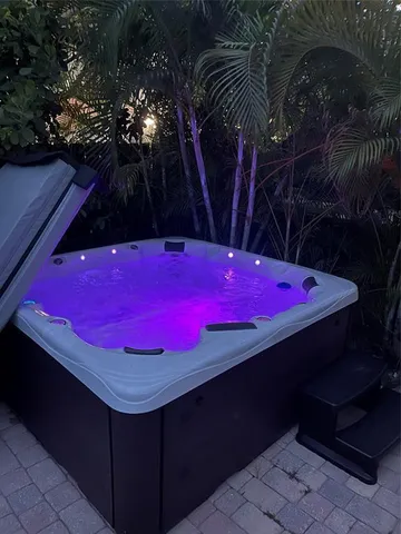 a spacious bathroom with double vanity a large mirror a bathtub and a shower