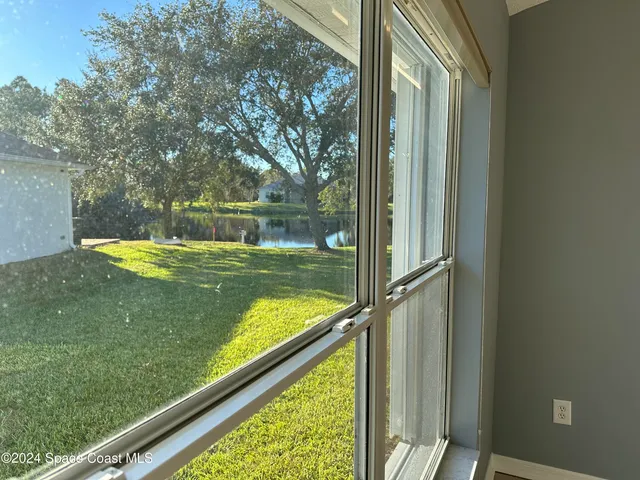 a view of a lake from a balcony