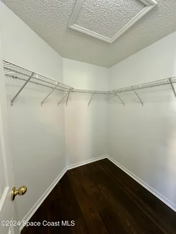 a view of a room with racks on the wall