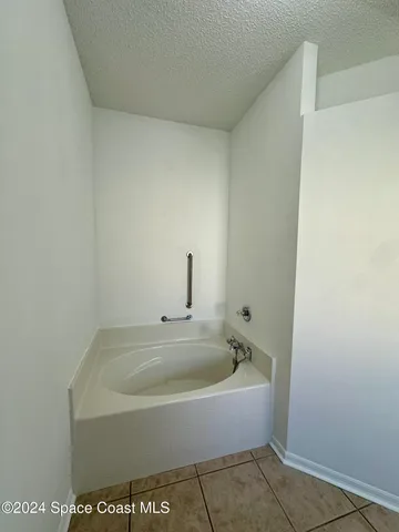 a white bath tub sitting in a bathroom