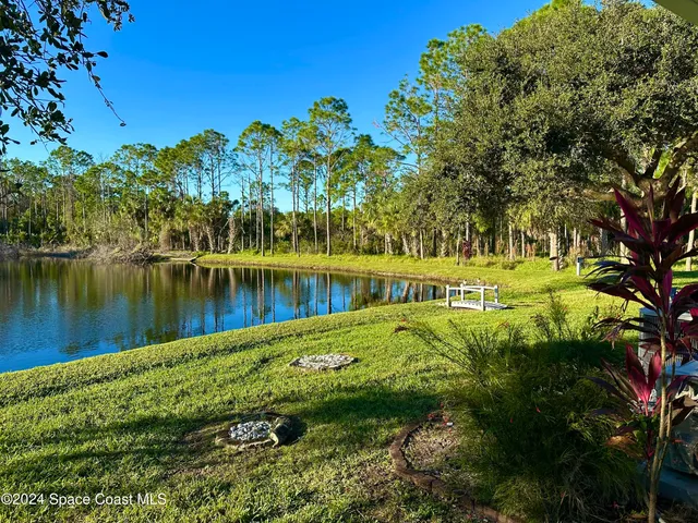 a view of a lake with a yard