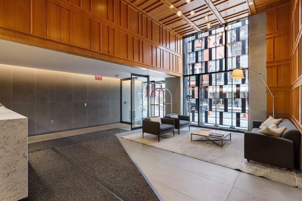 160 East 22nd Street, Unit 10D Manhattan, NY 10010 - Photo 10 of 12 a living room with furniture