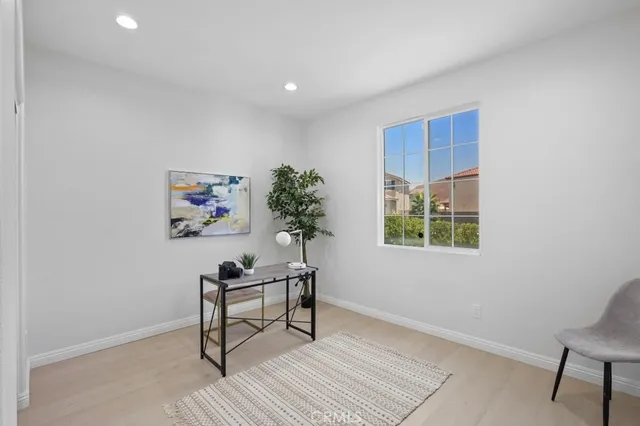 a workspace with furniture and a potted plant