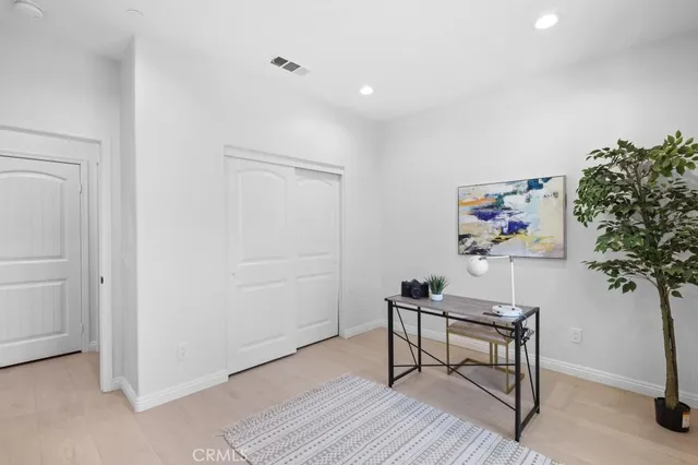 a workspace with furniture and wooden floor