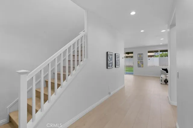 a bedroom with a bed and a chair