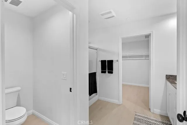 a bathroom with double vanity sinks and a mirror