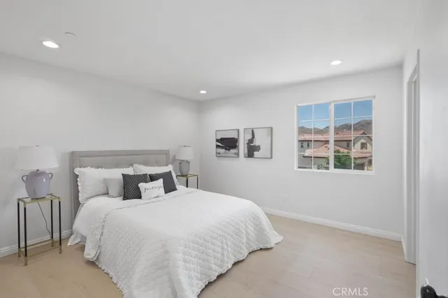 a bathroom with a granite countertop sink toilet a mirror and shower