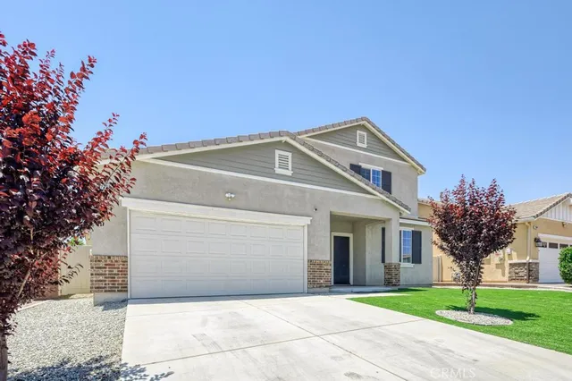 a view of a backyard with a garden and plants