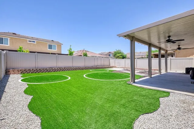 a view of a house with a yard and plants