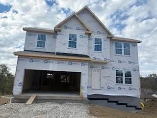 a bathroom with a sink vanity and shower