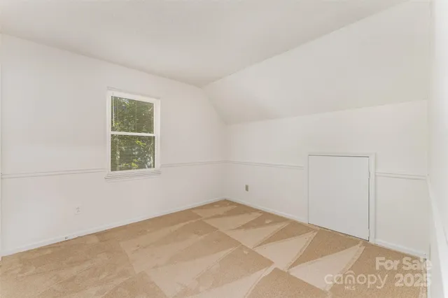 a view of balcony with wooden floor and fence