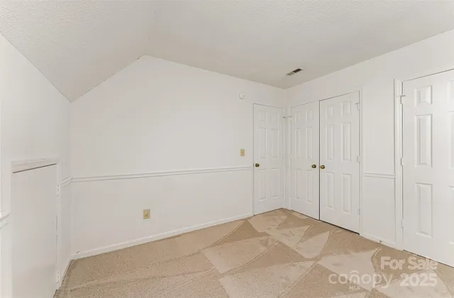 a view of a deck with wooden floor and fence next to a yard